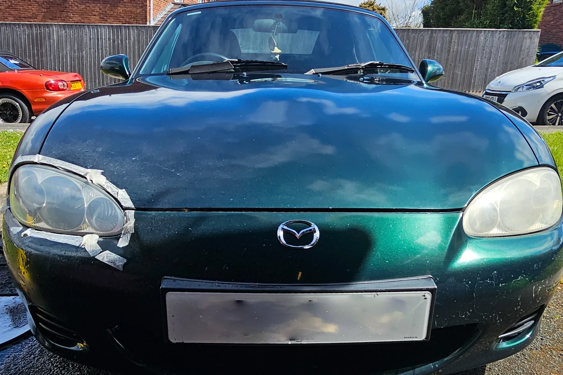 Headlight restoration split view in Plymouth